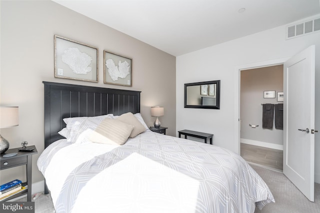 bedroom with visible vents and baseboards