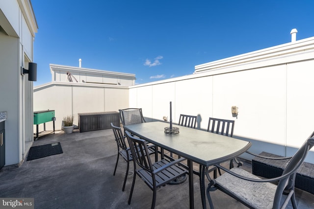 view of patio with fence and outdoor dining area