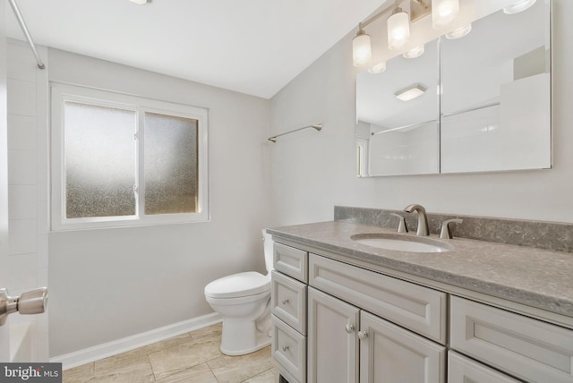 bathroom with toilet and vanity