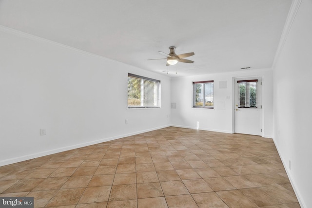 spare room featuring crown molding and ceiling fan