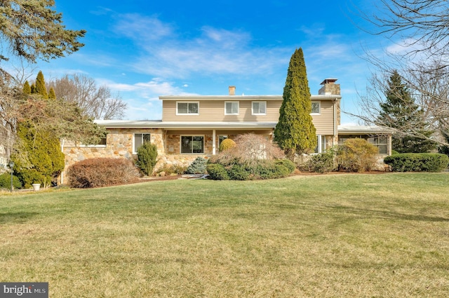 view of front of home with a front lawn