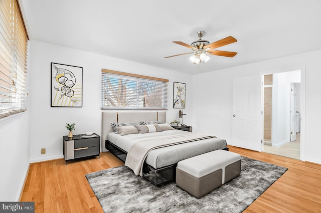 bedroom with ceiling fan and wood-type flooring