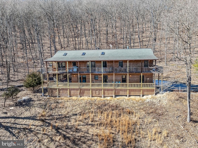606 Rocky Branch Rd, Baker, WV 26801 - view of front of home featuring a forest view and a balcony