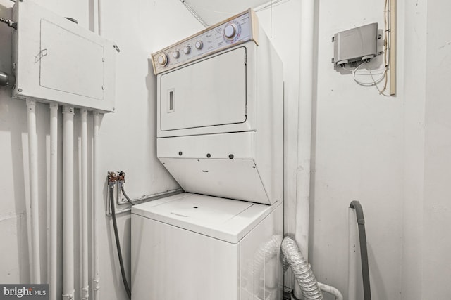 laundry room with stacked washer and clothes dryer