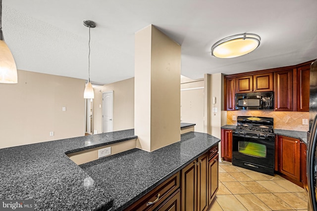 kitchen featuring dark stone countertops, light tile patterned floors, black appliances, hanging light fixtures, and decorative backsplash