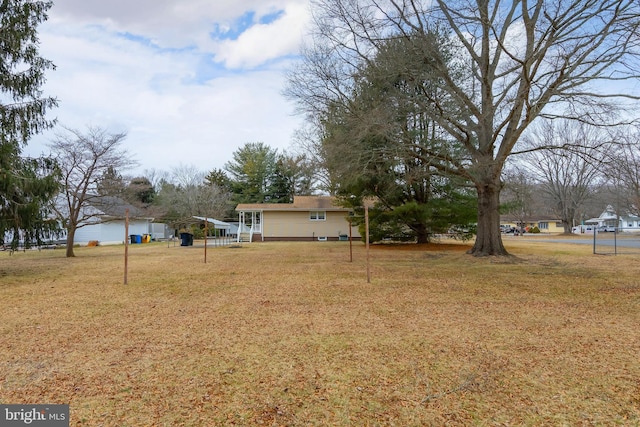 view of yard featuring a carport