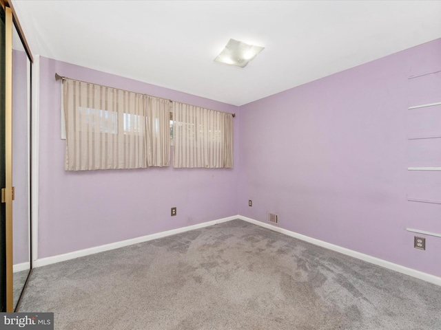 view of carpeted spare room