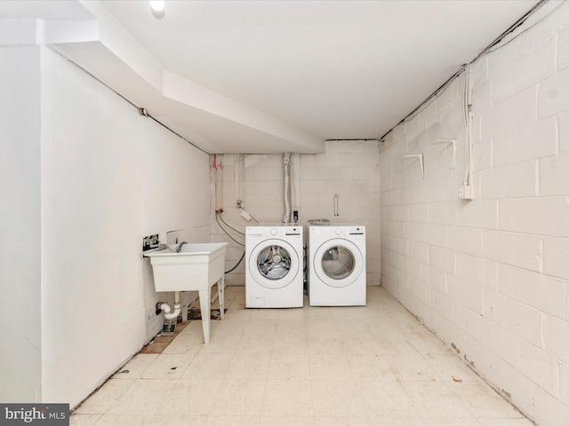 laundry room featuring separate washer and dryer