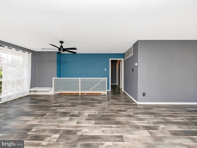 unfurnished room with hardwood / wood-style flooring and ceiling fan