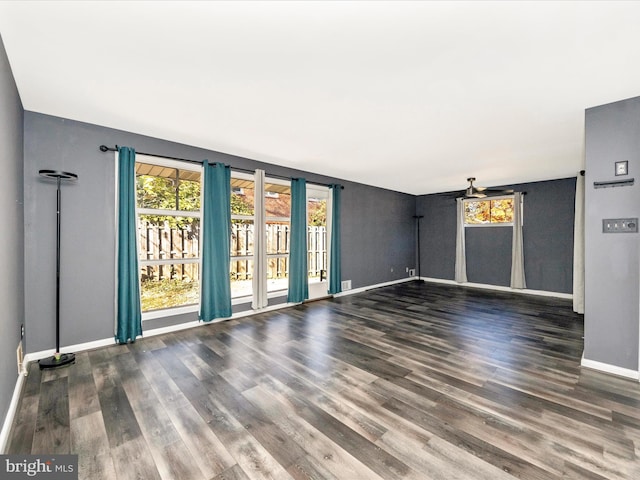 unfurnished room with dark hardwood / wood-style floors