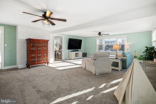 carpeted living room featuring ceiling fan