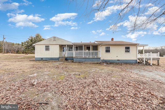 rear view of house with a porch