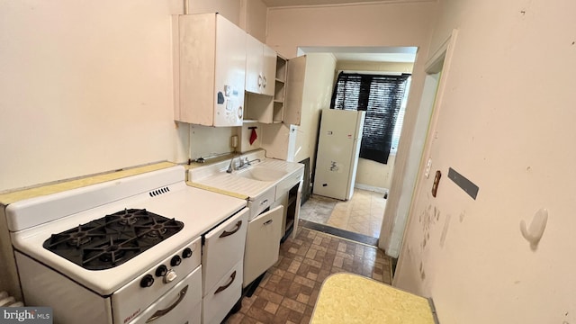 kitchen with sink and white cabinetry