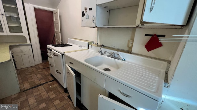 clothes washing area with sink