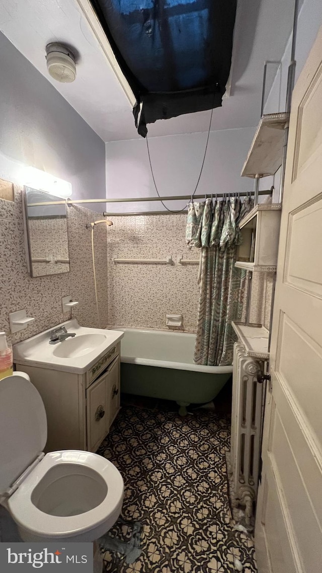 full bathroom featuring toilet, radiator heating unit, shower / bath combo with shower curtain, tile patterned floors, and vanity