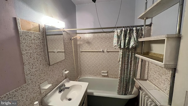 bathroom with shower / tub combo with curtain and vanity