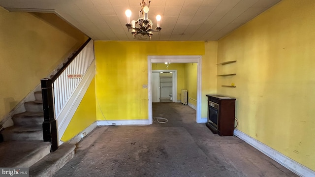 interior space with radiator heating unit and a chandelier