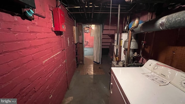 basement featuring washing machine and clothes dryer