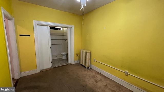 interior space featuring carpet flooring and radiator