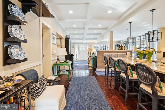 interior space featuring dark wood-type flooring, coffered ceiling, beamed ceiling, and recessed lighting