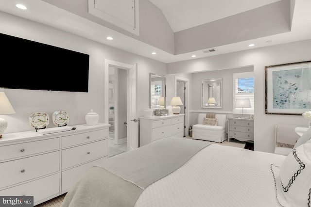 bedroom with visible vents, vaulted ceiling, connected bathroom, and recessed lighting