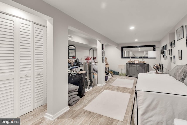 bedroom featuring baseboards, recessed lighting, visible vents, and wood tiled floor