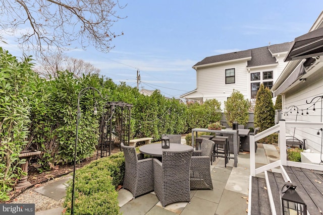 view of patio featuring outdoor dining area