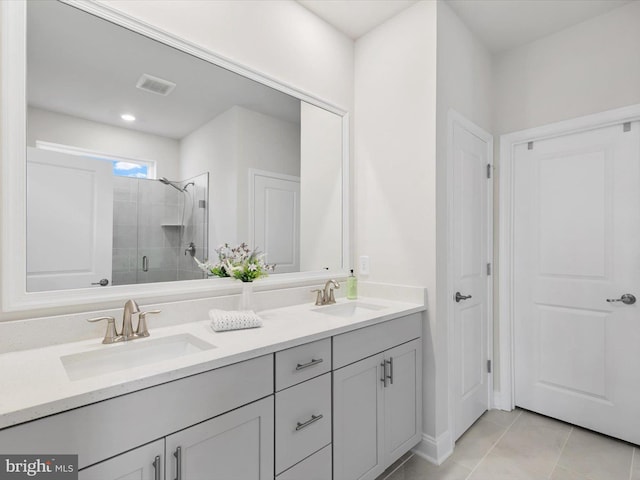 33423 Hickory St, Millsboro, DE 19966 - full bathroom featuring tile patterned flooring, visible vents, a stall shower, and a sink