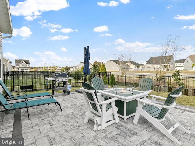 33423 Hickory St, Millsboro, DE 19966 - view of patio / terrace with fence, a residential view, an outdoor fire pit, outdoor dining area, and a grill