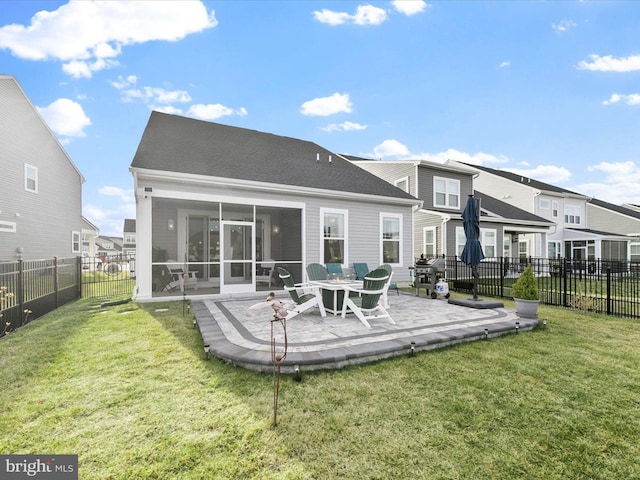 33423 Hickory St, Millsboro, DE 19966 - back of property with a fenced backyard, a patio, a yard, and a sunroom