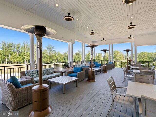 33423 Hickory St, Millsboro, DE 19966 - wooden deck with an outdoor living space