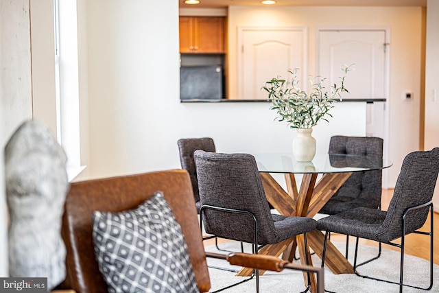 dining room featuring light wood-style floors and recessed lighting