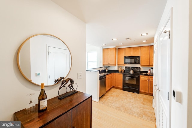 kitchen featuring black appliances, brown cabinetry, dark countertops, and recessed lighting