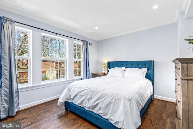 bedroom with baseboards, recessed lighting, dark wood finished floors, and crown molding