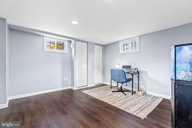 office area with baseboards and dark wood-style flooring