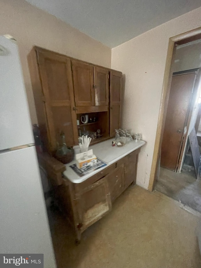 kitchen featuring white fridge