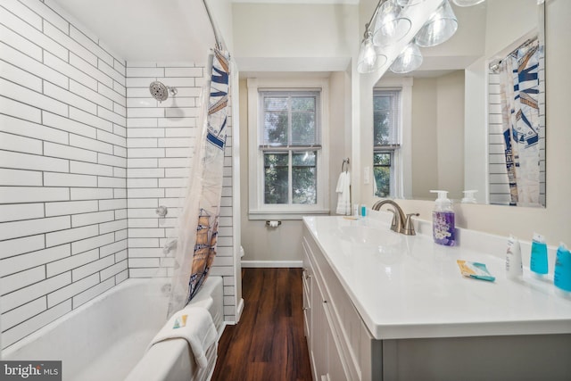 full bathroom featuring toilet, vanity, wood-type flooring, and shower / bath combo with shower curtain