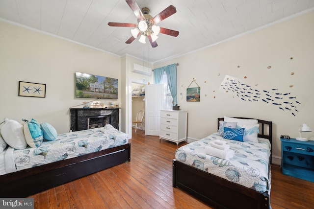 bedroom featuring hardwood / wood-style floors, ceiling fan, and ornamental molding