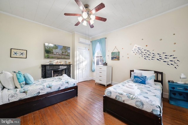 bedroom featuring wood-type flooring, ceiling fan, crown molding, and a wall mounted air conditioner