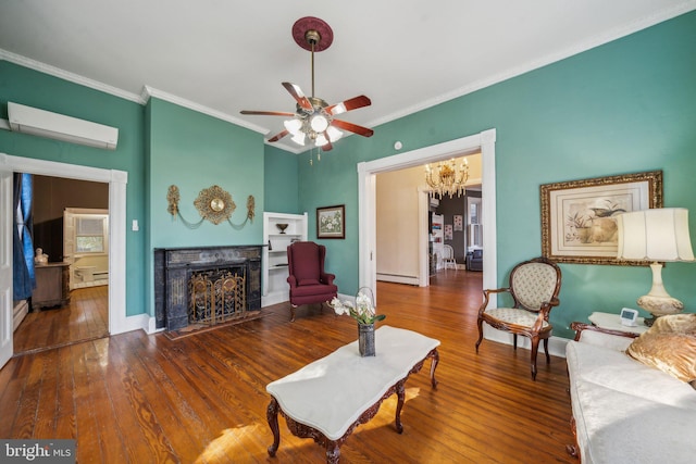 living room featuring hardwood / wood-style floors, a premium fireplace, an AC wall unit, a baseboard heating unit, and crown molding