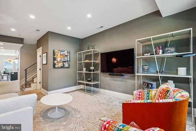 living room with an inviting chandelier