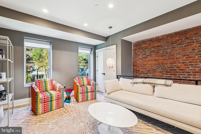 living room featuring brick wall