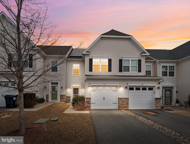 multi unit property featuring a garage