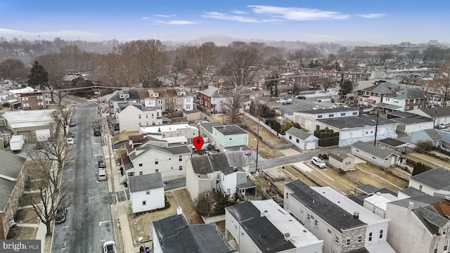 birds eye view of property with a residential view