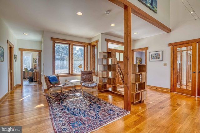 interior space featuring light wood-style flooring, recessed lighting, baseboards, and french doors