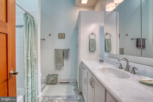 bathroom with vanity, a shower with curtain, and baseboards