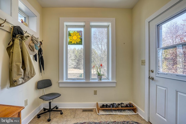 doorway featuring visible vents and baseboards