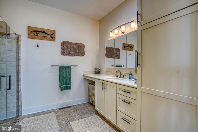 bathroom with visible vents, baseboards, vanity, and a tile shower