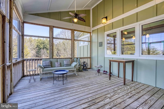 unfurnished sunroom featuring lofted ceiling and ceiling fan