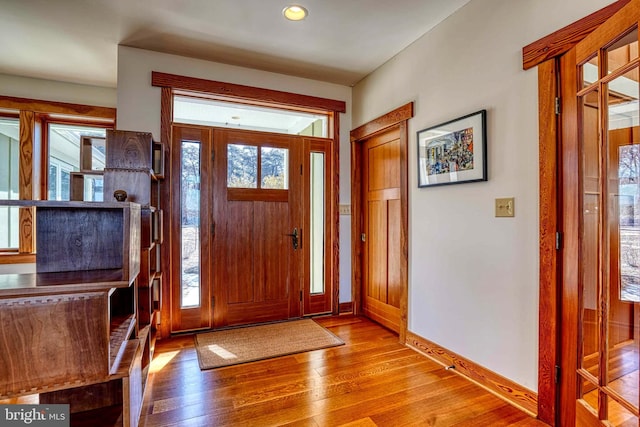 entrance foyer featuring recessed lighting, baseboards, and wood finished floors